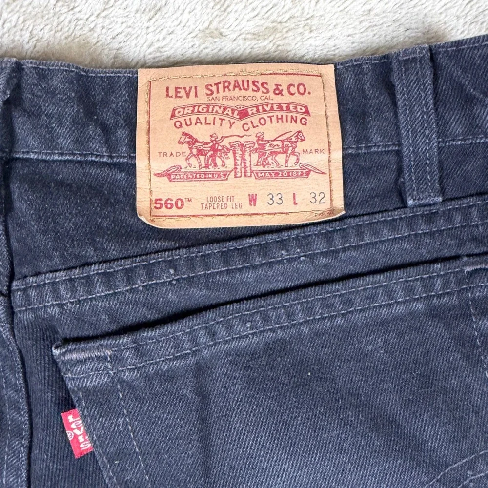 Vintage Levis 560 Black Loose Fit Tapered Leg Jeans Mens 33x32 Made in USA 1997